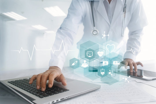Medicine doctor touching laptop and tablet computer interface as medical network connection with icon modern on virtual screen, Digital healthcare, medical technology network and innovation concept