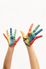 hands with colorful paint talking
