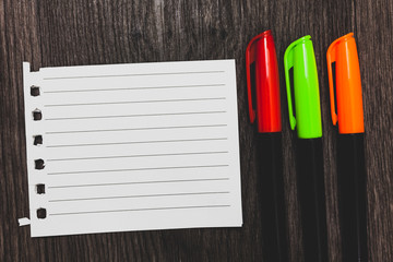 Design business Empty copy space text for Ad website promotion isolated Banner template. Colorful words with white page red green orange pen on blackish wooden desk