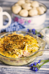 baked mashed potatoes with sausages and cheese in a plate