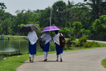 three school girls heading home