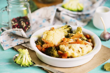 baked cauliflower and broccoli with cheese on a plate