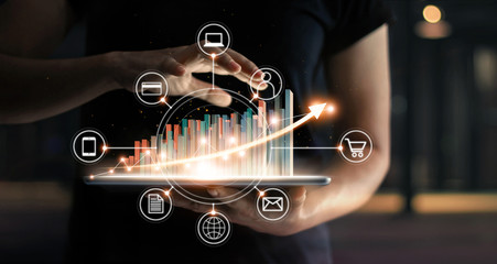 Business people holding tablet and graph chart statics growing in e-commerce global market and icon customer network connection on virtual interface. Arrow graph corporate future growth graph.