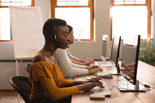 Business colleagues working on computer in office - Powered by Adobe