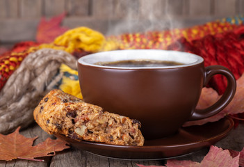 Steaming Cup of Coffee and Raisin Cookie
