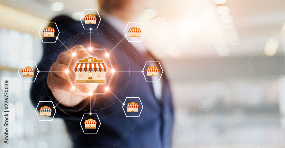 Poster businessman hand touching icon global network connection on franchise marketing system. branch of ma