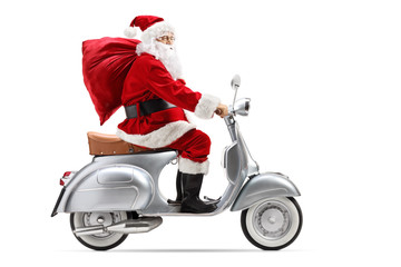 Santa Claus with a sack riding a vintage scooter © Ljupco Smokovski