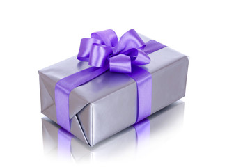 Gift box with purple ribbon on white background