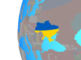 Ukraine with embedded national flag on blue political globe.