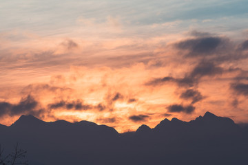 Orange sunset at mountains