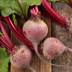 raw beetroot on wood background