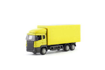Yellow truck miniature on white background 
