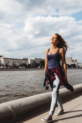 girl posing with skate board