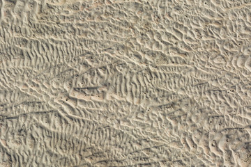 The surface of the limestone in the form of intricate patterns. The texture is made by flowing water for many years in Turkish Pamukalle. An interesting natural phenomenon.