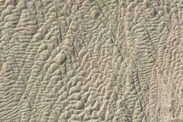 The surface of the limestone in the form of intricate patterns. The texture is made by flowing water for many years in Turkish Pamukalle. An interesting natural phenomenon.