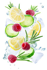 Lemon, cucumber, raspberry and rosemary flying with ices and water splash isolated