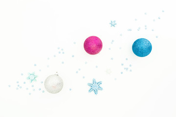 Fototapeta na wymiar Creativity New Year composition. Christmas balls and blue decorations on white background. Flat lay, top view