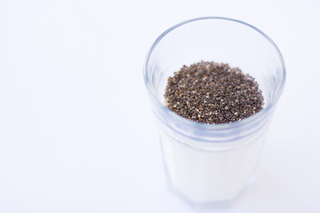 Chia seeds are drunk with airan from a glass.