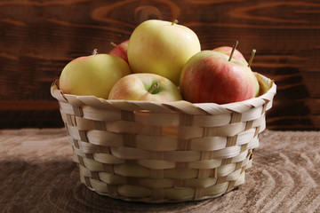basket full of apple and autumn leaves