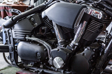 Plakat Cropped close up shot of beautiful and custom made motorcycle in the workshop