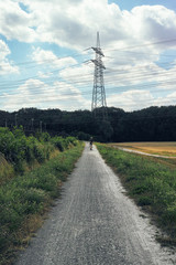 Street to nuclear power station old out of order germany nature tower sky plant rust fence closeup street land