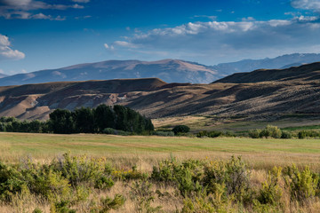Layered meadows,hills, and mountains near Dubois, Wyoming