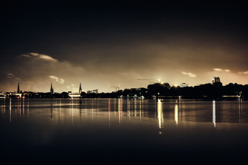 Obraz premium Stars black Alster Lake in Hamburg Germany house city christmas romantic sailing panorama sky night cloud panorama