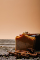 close-up shot of homemade soap with spices on rustic wooden tabletop