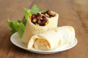 Burritos wraps with minced pork and vegetables.