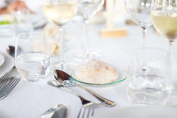  bread on white dish on the table in restaurant