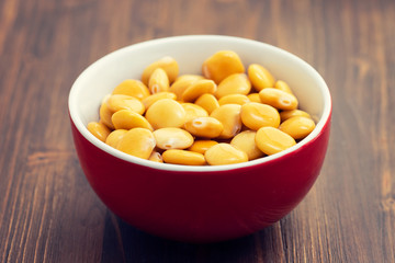 salted lupins in red bowl