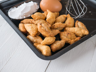 Karee puff, eggs and powder on white wooden background, Ingredients for cooking baking - flour,