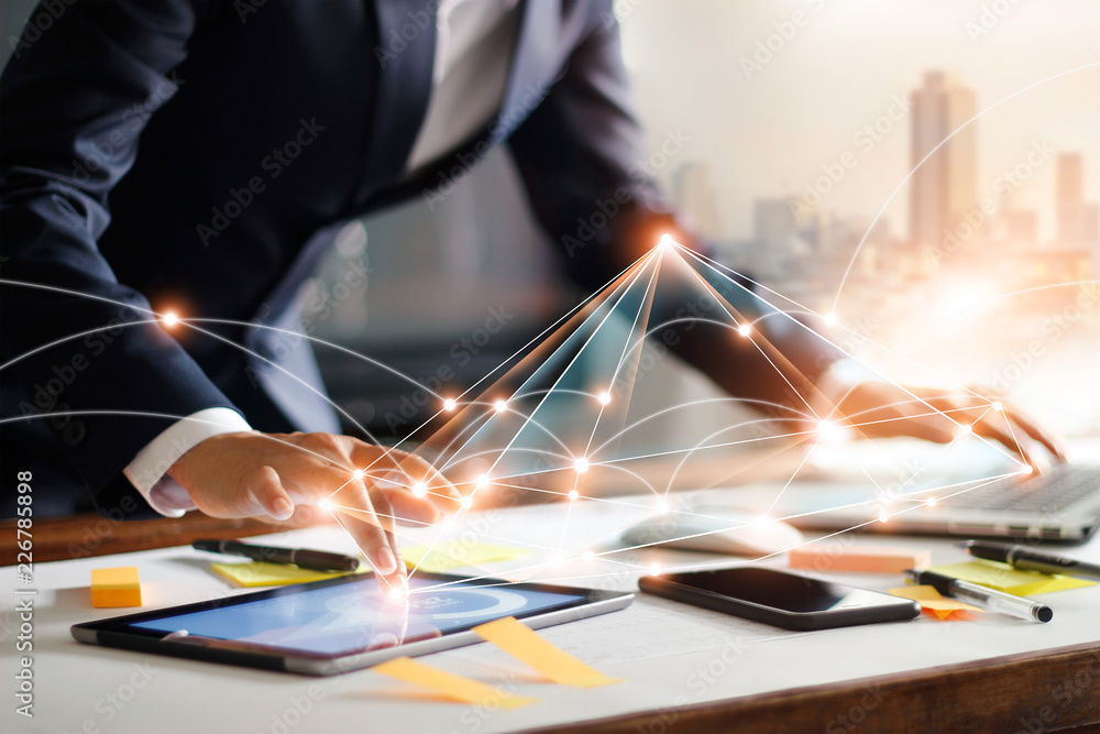 Poster Businessman touching tablet and laptop. Managng global structure networking and data exchanges customer connection on workplace. Business technology and digital marketing network concept.