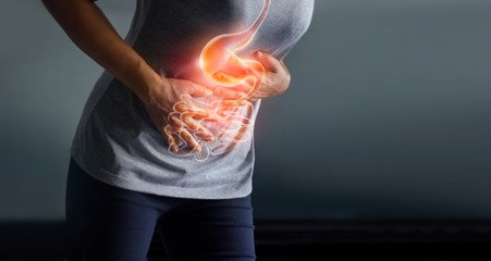 Woman touching stomach painful suffering from stomachache causes of menstruation period, gastric ulcer, appendicitis or gastrointestinal system desease. Healthcare and health insurance concept - obrazy, fototapety, plakaty