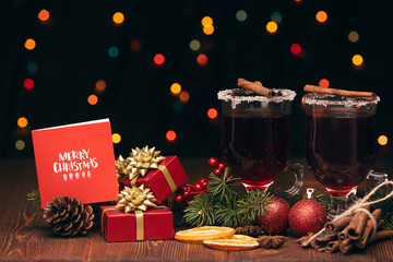 Glasses of mulled wine on wooden table