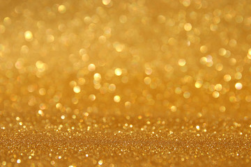 glitter vintage lights background. silver and gold. de-focused.