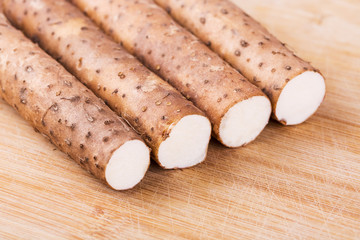 Yam on wooden table, closeup