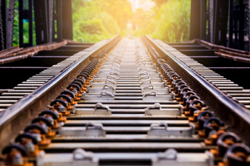 Railway track on steel bridge with selective focus.