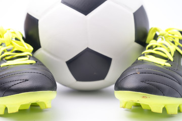 Football and a football shoes  isolated on white background.