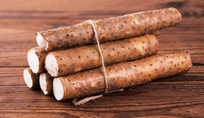 Yam on wooden table, closeup