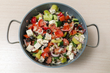 Greek salad in a large pot