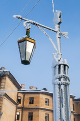 Fototapeta na wymiar Frozen street light on Mogilev bridge
