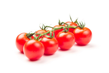 Cherry tomatoes isolated over white background