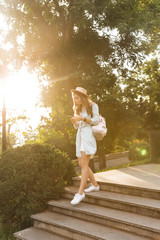 Lovely young teenage girl with backpack