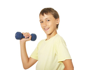 Portrait of a young boy doing exercises on white background