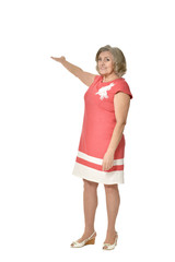 Portrait of a senior woman showing something on white background