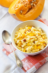 Milky cereal porridge with pumpkin and raisins