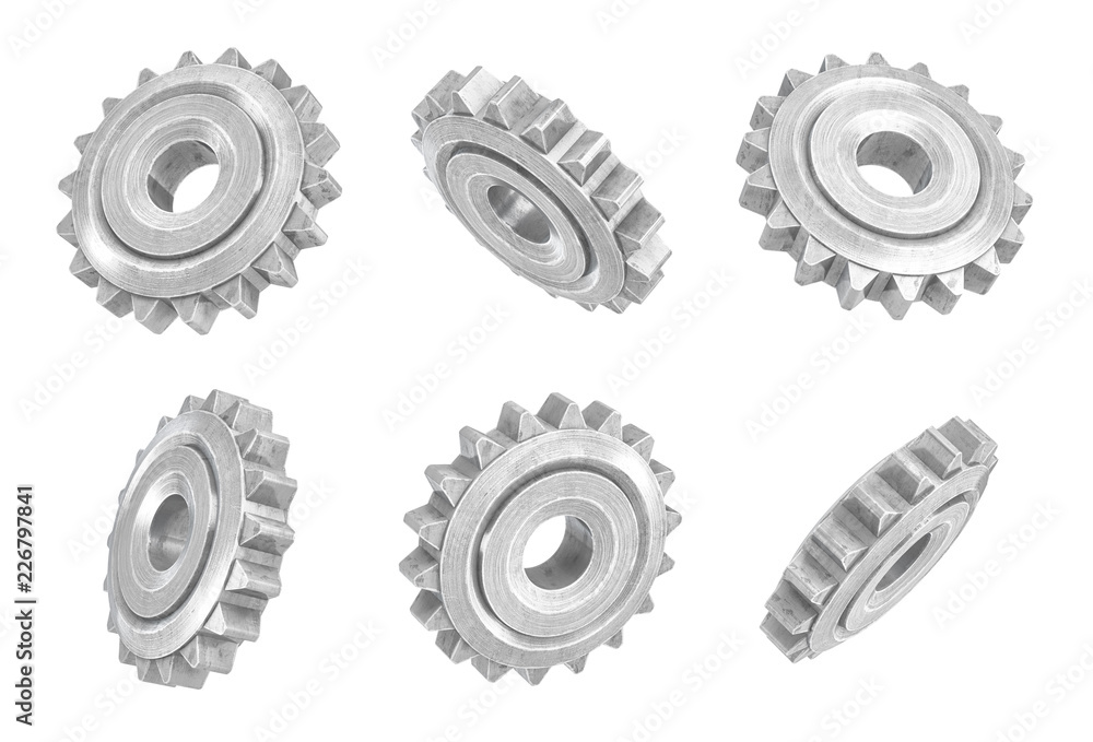 Poster 3d rendering of several metal spur gears hanging in different angles on a white background.