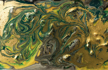 Green marble abstract acrylic background. Marbling artwork texture. Agate ripple pattern. Gold powder.