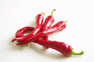 Fotobehang Fresh red chili peppers on white background, menu design concept  © stefanbalaz